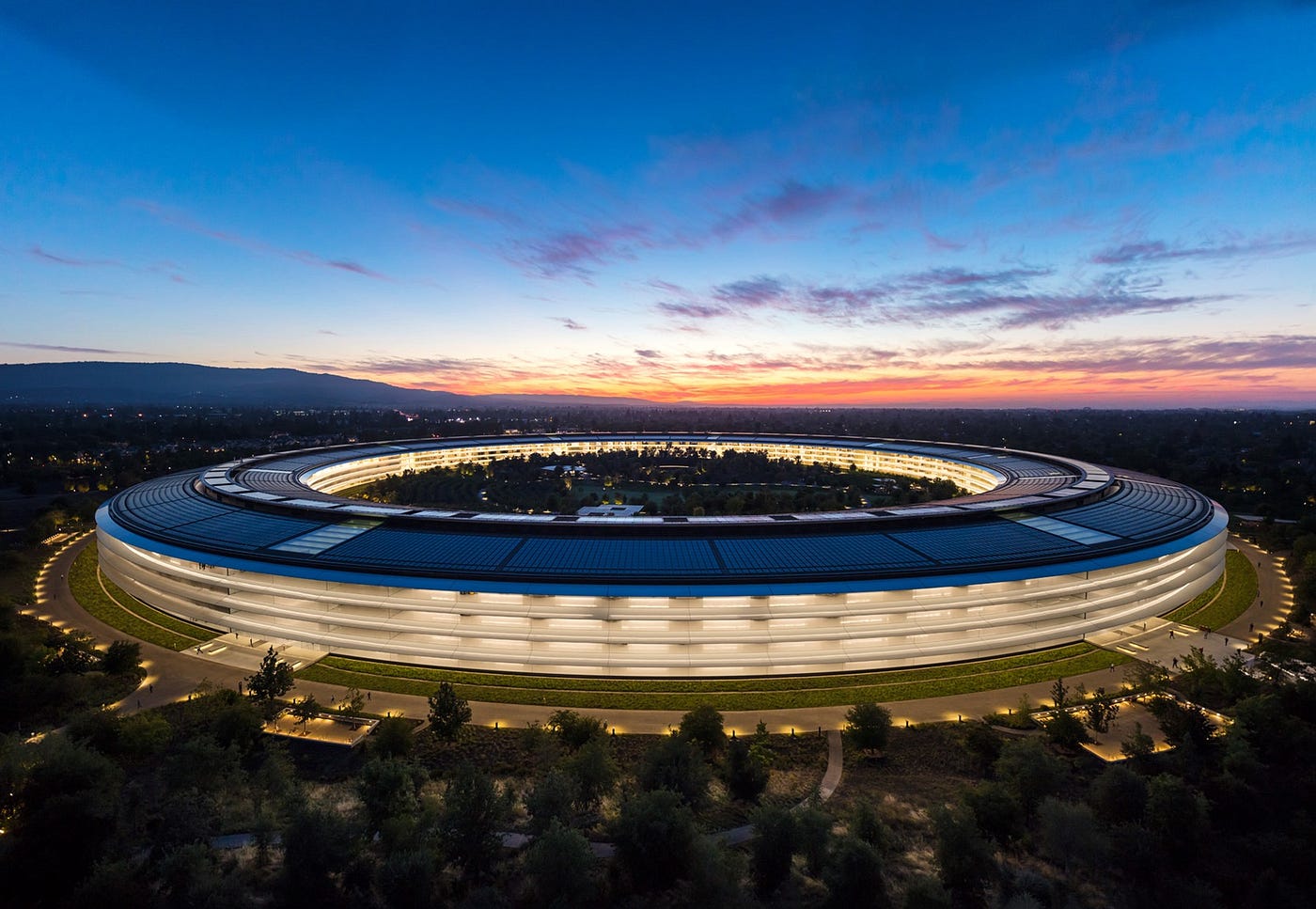 Apple Park headquarters at sunset
